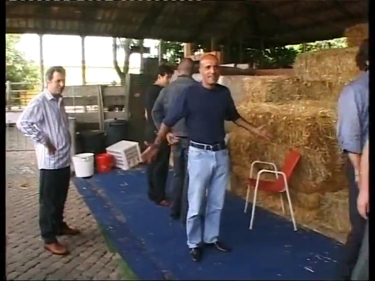 A group of men have sex with a naive blonde in a barn porn video